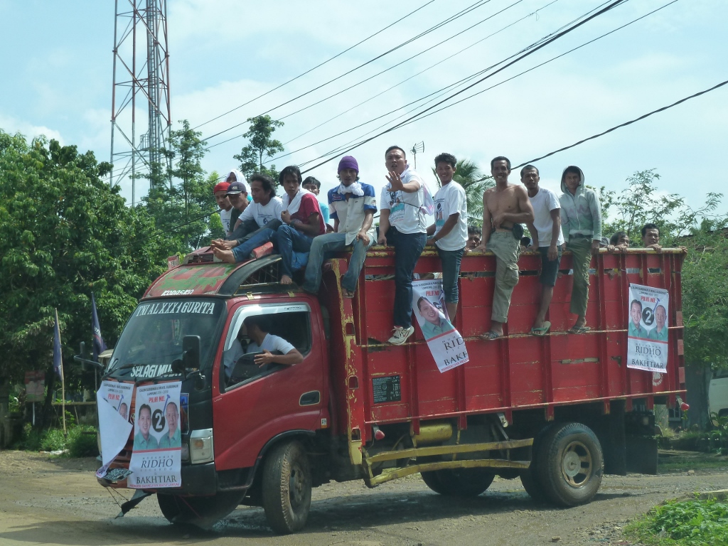 Locals drive to a Ridho campaign rally- Author's collection Ward 2 Ridho Rally resize